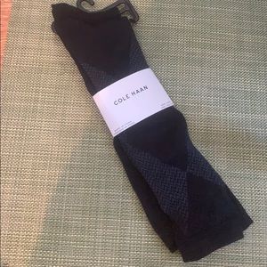 Two pairs of Cole Haan Knee High socks.